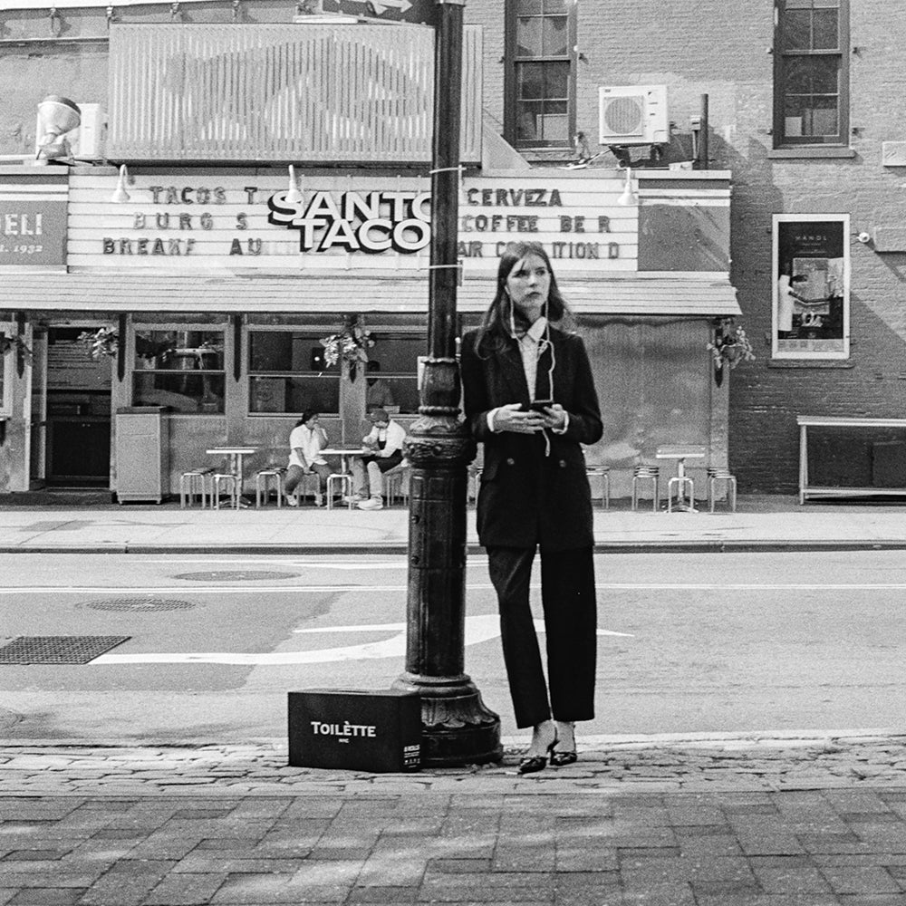 girl in streets of nyc with toilette box