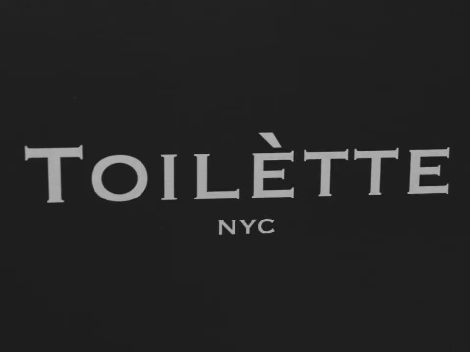 Girl walking with Toilètte Box in soho